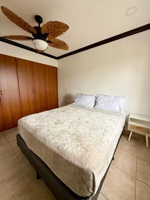 a bedroom with a bed with a ceiling fan at Relaxing 1BR Oasis near Tamarindo in Villarreal