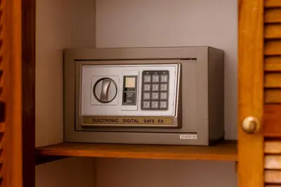 a microwave sitting on top of a shelf at Habitación doble pequeña - Casa Esmeralda in San José