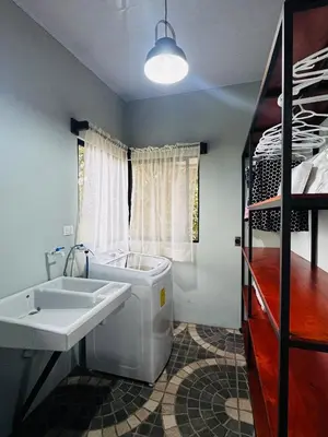 a bathroom with a tub and a sink and a bed at Cabina de las Hojas Monteverde in Monteverde Costa Rica