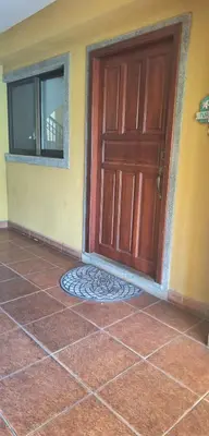 a door of a house with a tile floor at Relajante apartamento cerca de tamarindo in Garita