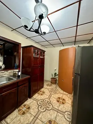 a kitchen with a refrigerator and a ceiling at Doucemaison in Tilarán