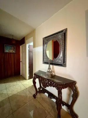 a room with a table and a mirror on the wall at Doucemaison in Tilarán