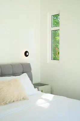 a bedroom with a white bed and a window at T Loft in Playa Hermosa