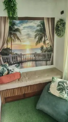 a room with a couch with a painting on the wall at La casita de Nana in Esparza
