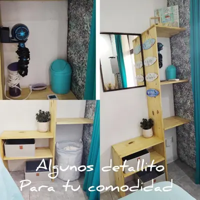 a room with a mirror and a shelf with plants at La casita de Nana in Esparza