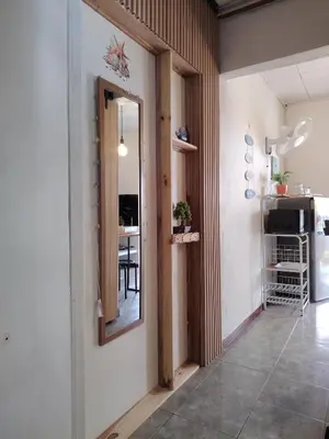 a hallway with a mirror and a dining room at La casita de Nana in Esparza