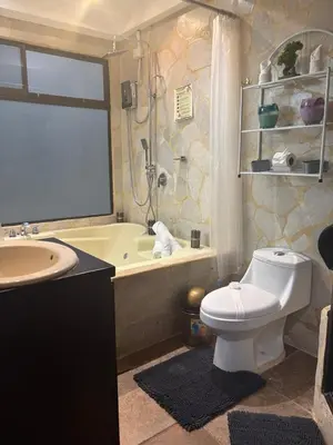 a bathroom with a toilet and a tub and a sink at Casa Mathi in Portegolpe