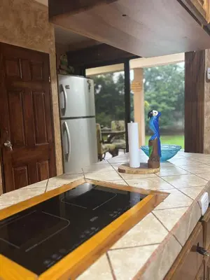 a kitchen with a counter top with a refrigerator at Casa Mathi in Portegolpe