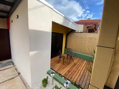 a balcony of a house with a wooden deck at Casa Iriria, in harmony with nature in Carpintero