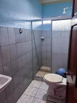 a bathroom with a toilet and a sink at Hotel Mavi in El Achiote