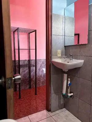 a bathroom with a sink and a mirror at Hotel Mavi in El Achiote