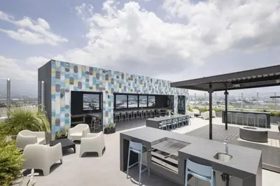 a rooftop patio with a table and chairs at Modern Apartment located in Trendy San Jose Condo in San José