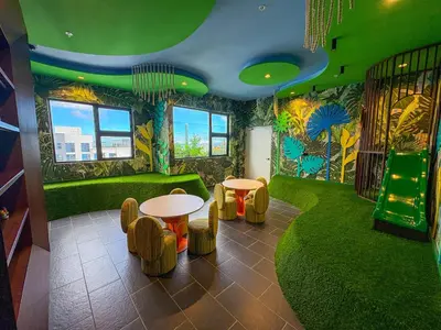 a room with green walls and a table and chairs at Modern Apartment located in Trendy San Jose Condo in San José