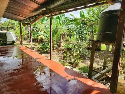 an inside view of a house with water on the ground at Casa de campo Bijagua in Upala