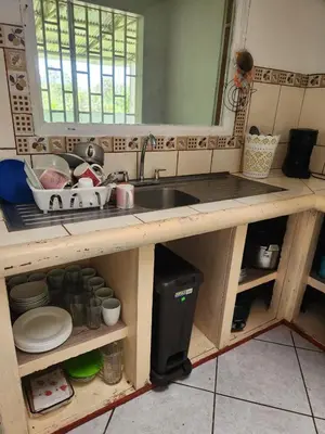 a kitchen with a sink and a counter top at Casa de campo Bijagua in Upala