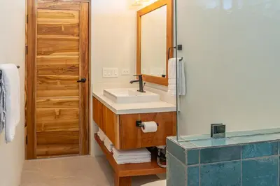 a bathroom with a sink and a mirror at Luxury villa in Samara beach- Casa Armonía in Sámara