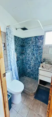 a bathroom with a toilet and a sink at Bus hotel Playa Barrigona, entre Sàmara y Nosara in Nicoya