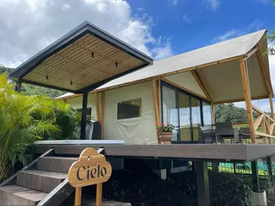 a tiny house with a sign in front of it at Safari Tent El Cielo in Santa Ana