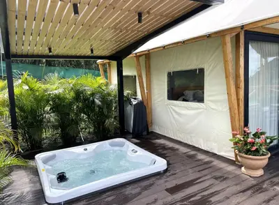 a hot tub sitting inside of a tent at Safari Tent El Cielo in Santa Ana