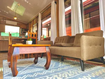 a living room with a couch and a coffee table at Tribu Bungalows 3 Romantic Spot in Fortuna