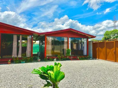 a house with a red roof and glass windows at Tribu Bungalows 5 Nice Interior Design in Fortuna