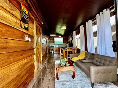 a living room with a couch and a table at Tribu Bungalows 5 Nice Interior Design in Fortuna
