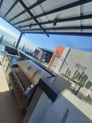 a view of a kitchen on the roof of a house at Nuevo y moderno loft en Bö Escalante in San José