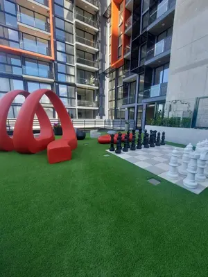 a building with a chess board and a largeadobeadobeadobeadobeadobeadobeadobe at Nuevo y moderno loft en Bö Escalante in San José