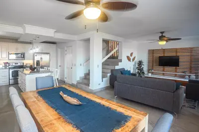 a living room with a couch and a table at Oceanview 3BR Villa with 3 Shared Pools and Beachfront Resort Access in Ocotal