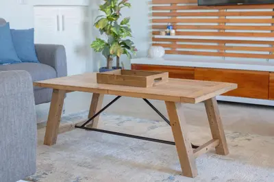 a wooden coffee table in a living room at Oceanview 3BR Villa with 3 Shared Pools and Beachfront Resort Access in Ocotal