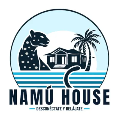 a house on the beach with a cat and palm trees at Namú Apartment in Herradura