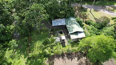 an aerial view of a house with a green roof at ParadiseTropical Garden Cabin with private jacuzzi in Fortuna