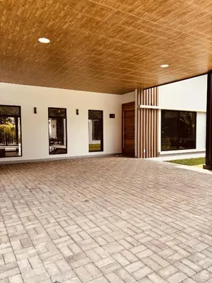a large empty room with a ceiling and windows at Casa Morfa in Uvita