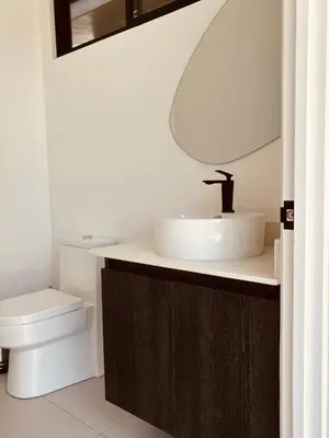 a bathroom with a sink and a toilet at Casa Morfa in Uvita