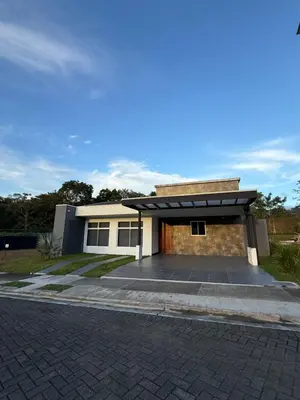 a house with a parking lot with a garage at Casa kai in Agujas
