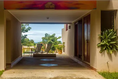 a view from the porch of a house at Romantic 1BR Studio Guesthouse with 3 Shared Pools, Beach and Resort Access in Ocotal