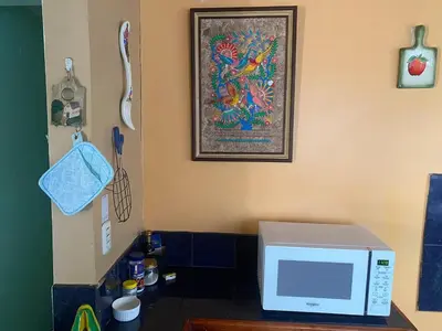 a microwave sitting on top of a counter in a kitchen at Close to Walmart supermarket chain in San Pablo