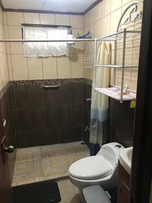 a bathroom with a shower with a toilet and a sink at Close to Walmart supermarket chain in San Pablo