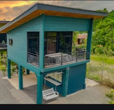 a tiny house with a zebra on the deck at Refugio Turquesa-Luxury King Suite with Private Jacuzzi Balcony-5 min to La Fortuna in Fortuna