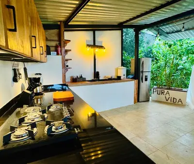 a kitchen with a stove and a counter top at Kayala Dome - Private luxury Dome in La Ese