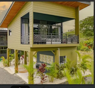 a house with a balcony with zebras on it at Paraiso Lima -Luxury King Suite with Private Jacuzzi Balcony-5 min to La Fortuna in Fortuna