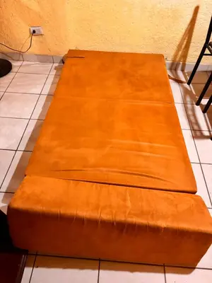 two wooden benches sitting on a tile floor at El Descanso in Jacó