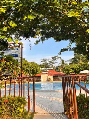 a view of a swimming pool with a fence at El Descanso in Jacó
