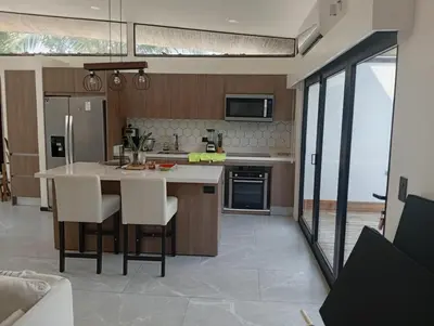 a kitchen with a large island in the middle at Casa Santoni in Quebrada Ganado