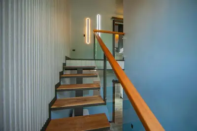 a group of stairs in a room with blue floors at La Azulada-5min La Fortuna, King beds, pool, BBQ in Fortuna