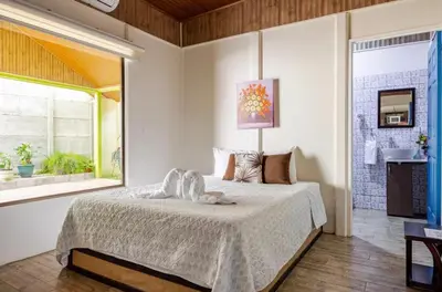 a bedroom with a bed and a window at Apartamentos Ranas y Ranitas, Apartamento #2 in Fortuna