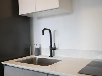 a kitchen counter with a sink and aaucet at Ser Escalante Modern Studio AC in San José