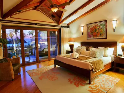 a bedroom with a bed and a ceiling fan at Apartment located in The Palms Private in Playa Flamingo, Costa Rica in Portegolpe