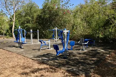 a group of blue exercise equipment in a park at Juanderlust - 2 Bedroom Condo in Tamarindo
