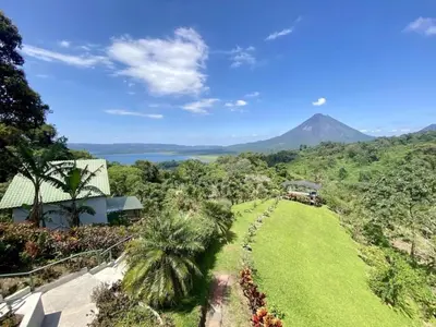 a view of a hill with a mountain in the background at Arenal Birdsong, Entire Villa W- Stunning Views,! in El Castillo de La Fortuna